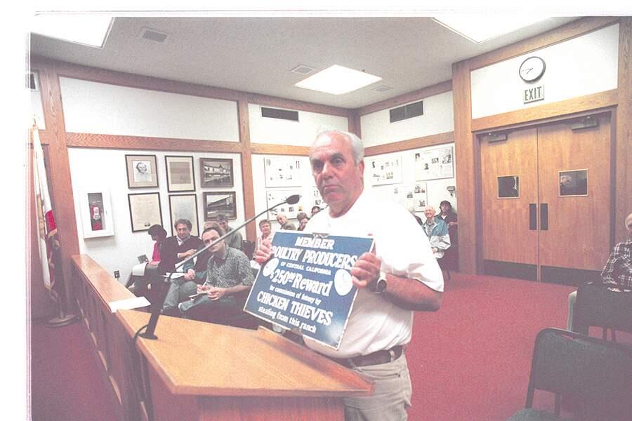 Jerry Marino brandished a sign before the Sonoma City Council in 1999 offering a $250 reward for the capture of chicken thieves.Jeff Kan Lee/Press Democrat