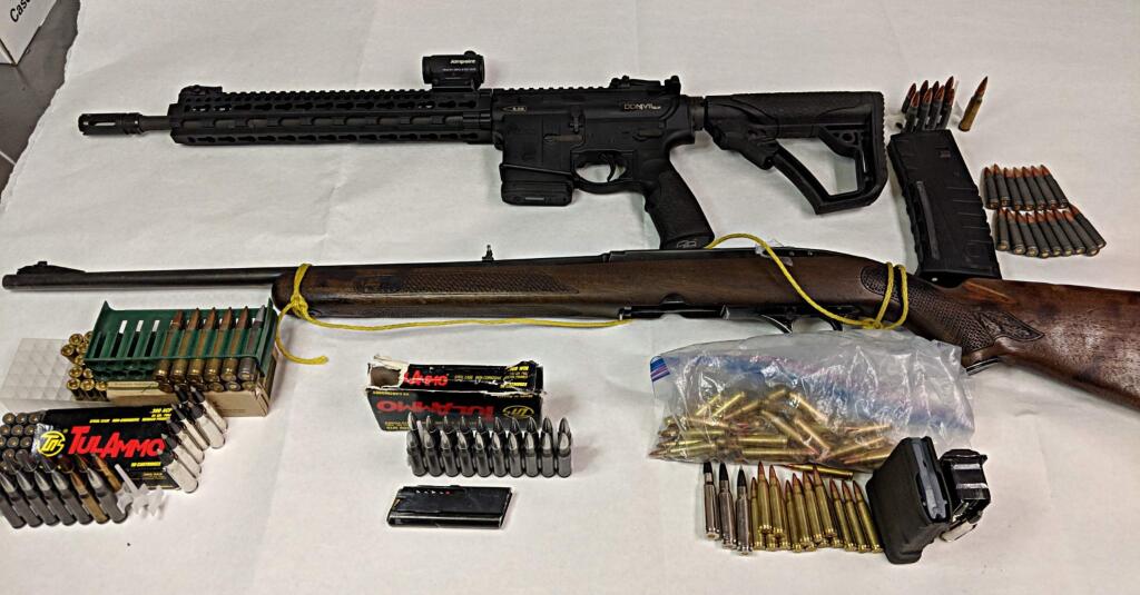 The assault rifle and other guns found by Petaluma police after searches of homes on Park Lane and Petaluma Boulevard North on Monday, Oct. 29, 2018. (COURTESY OF PETALUMA POLICE)