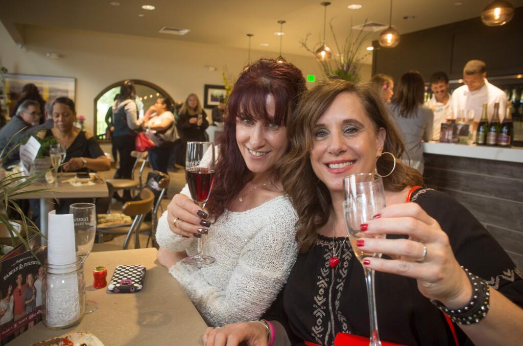 Briana Smolowe, left, and Brenda Moretti attend the first annual Bubbles and Blooms Festival at Gloria Ferrer Caves and Vineyards in Sonoma, Calif., Saturday, April 10, 2016. Guests met professionals from Flower Magazine and learned creative floral arranging along with spring flower/vegetable garden tips. (Jeremy Portje / For The Press Democrat)
