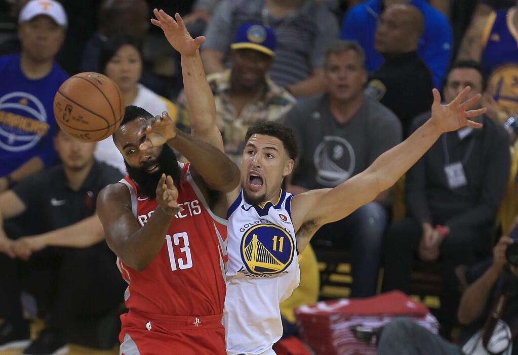 Klay Thompson blocks the shot of Houston's James Harden during the third quarter of the Warriors' 115-86 win over the Rockets in Game 6 of the NBA Western Conference final in Oakland, Saturday, May 26, 2018. (Kent Porter / The Press Democrat)