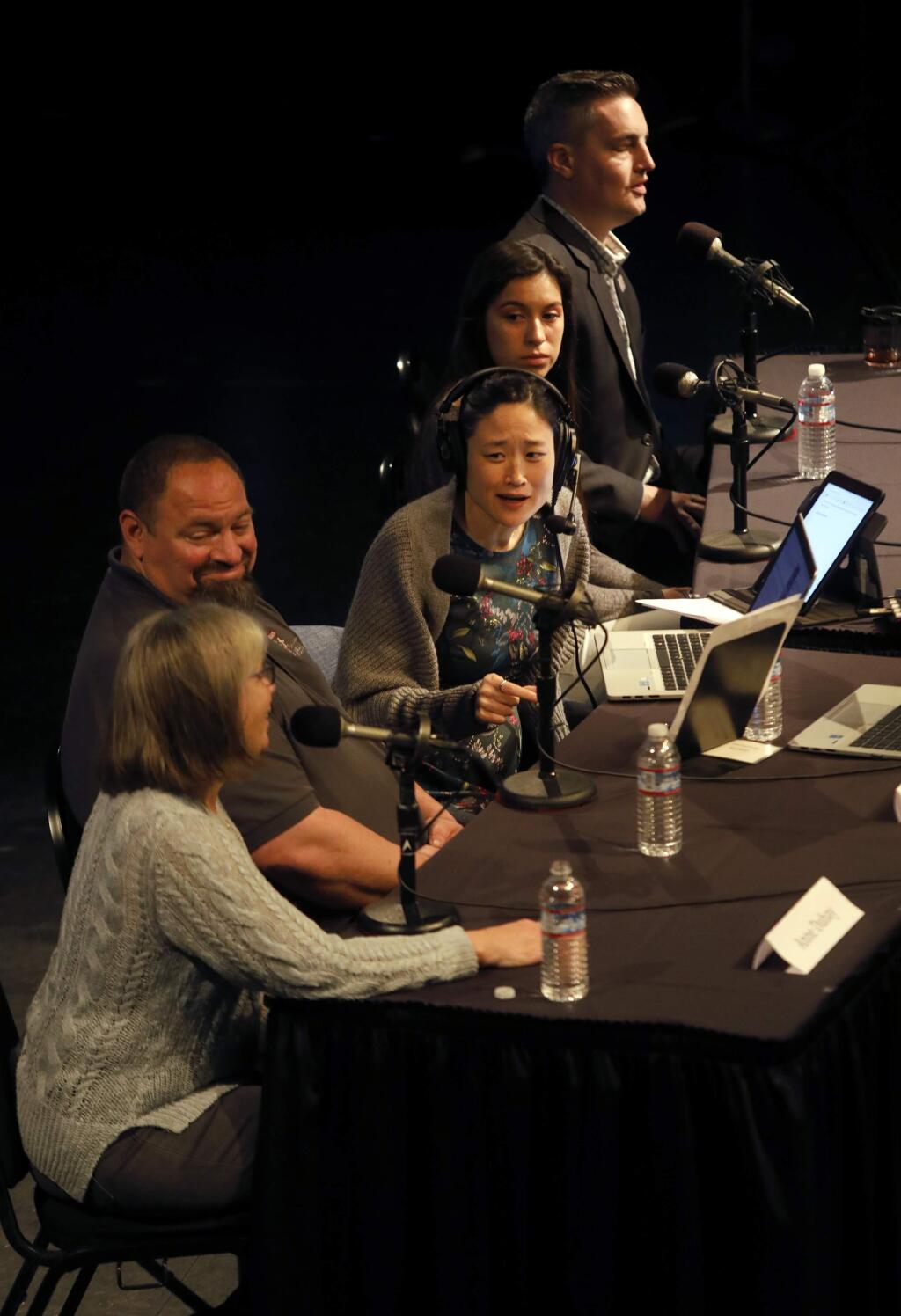 KQED's Forum host Mina Kim, center, talks with guests (From bottom) Anne DuBay, Chris Keys, Dayren Torres, and Jeff Okrepkie, at the Luther Burbank Center for the Arts in Santa Rosa, on Friday, April 6, 2018. (BETH SCHLANKER/ The Press Democrat)
