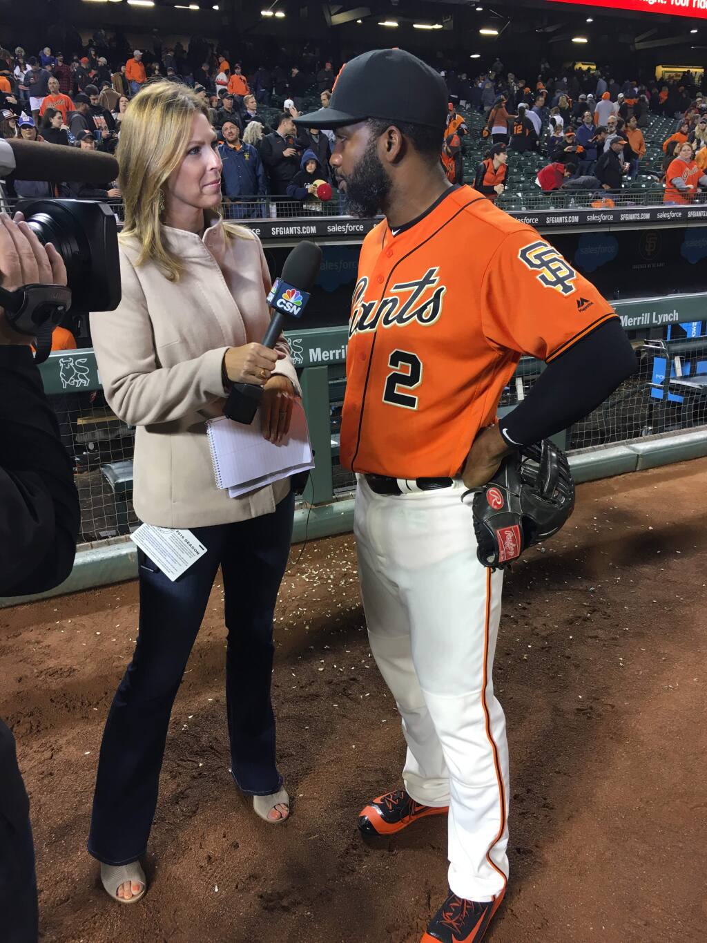 Petaluma native Amy Gutierrez, known as 'Amy G' with the Giants, interviews Giants centerfielder Denard Span in a 'Hero of the Game' after a game in 2016 at AT&T Park. (CAITLYN CRAWFORD)