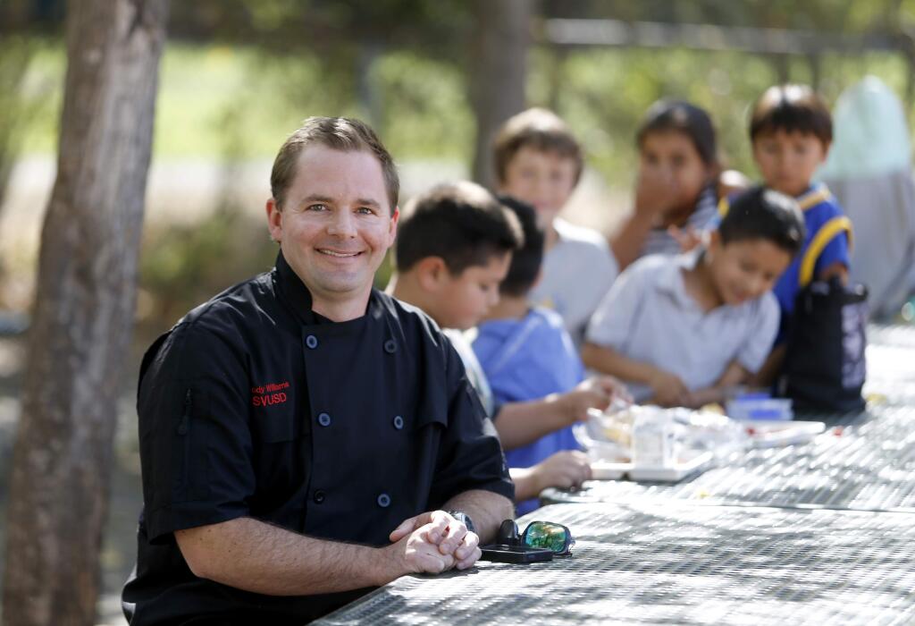 BETH SCHLANKER / The Press Democrat Cody Williams, head of food service at Sonoma Valley Unified School District, joins students for lunch at Flowery Elementary School in Boyes Hot Springs.