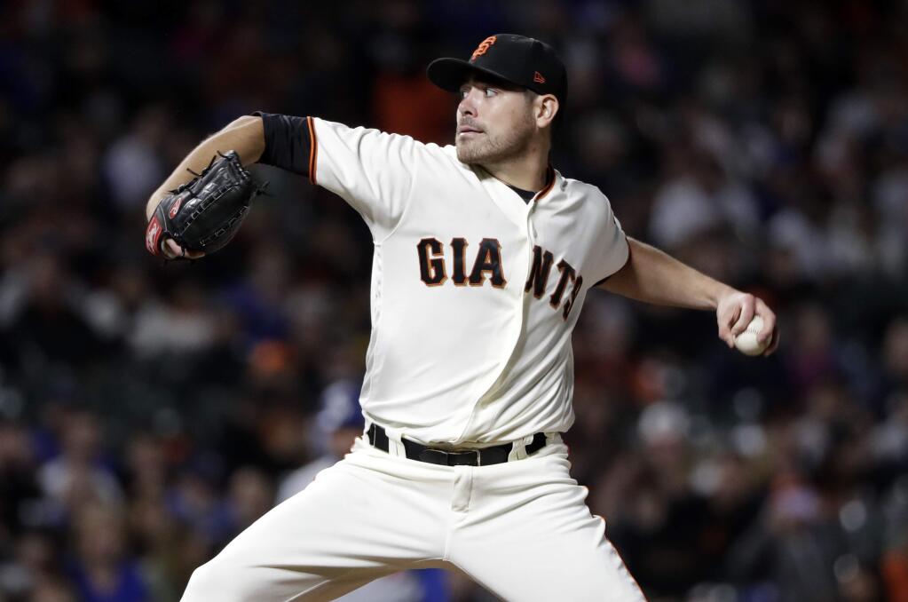 San Francisco Giants starting pitcher Matt Moore throws to a Los Angeles Dodgers batter during the second inning Wednesday, Sept. 13, 2017, in San Francisco. (AP Photo/Marcio Jose Sanchez)