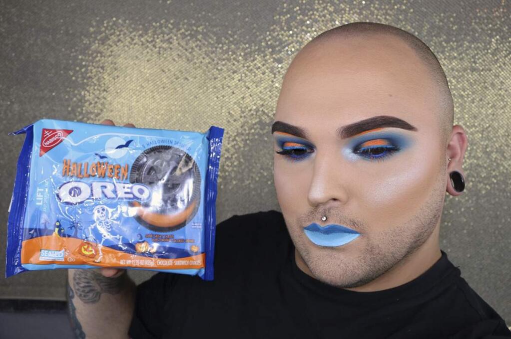 In an undated handout photo, Tim Owens, who goes by Skelotim on social media, with Oreos. He takes inspiration for his makeup looks from snack food packaging. Skelotim is one of a handful of young men who have primped and preened their way into the female-centric world of Instagram and YouTube makeup artistry. (Handout via The New York Times)