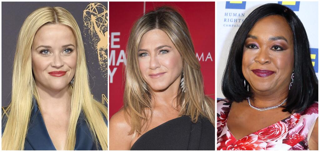 FILE- This combination of file photos show actresses Reese Witherspoon at the 69th Primetime Emmy Awards in Los Angeles, left, Jennifer Aniston at a screening of 'Office Christmas Party' in New York and Shonda Rhimes at the 2015 Human Rights Campaign Gala Dinner in Los Angeles. Witherspoon, Rhimes and Aniston are among hundreds of Hollywood women who have formed an anti-harassment coalition called Time's Up. (AP Photo/File)