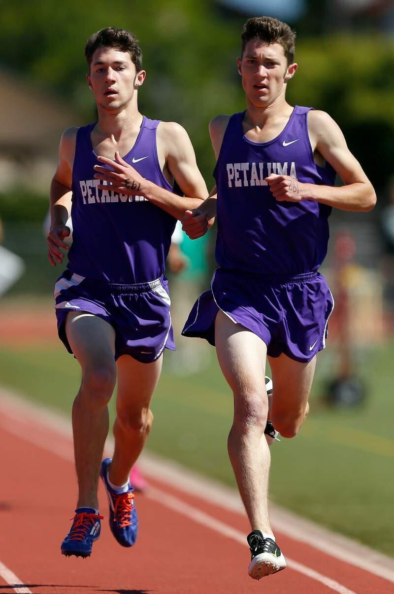 ALVIN JORNADA/THE PRESS DEMOCRATPetaluma High brothers Will and Jack Dunbar race to the finish in the 1600-meter run in the SCL championship meet. Jack, right, finished first with Will second. The brothers had nearly the same finish in the Redwood Empire Championship Meet, with Jack first and Will third.