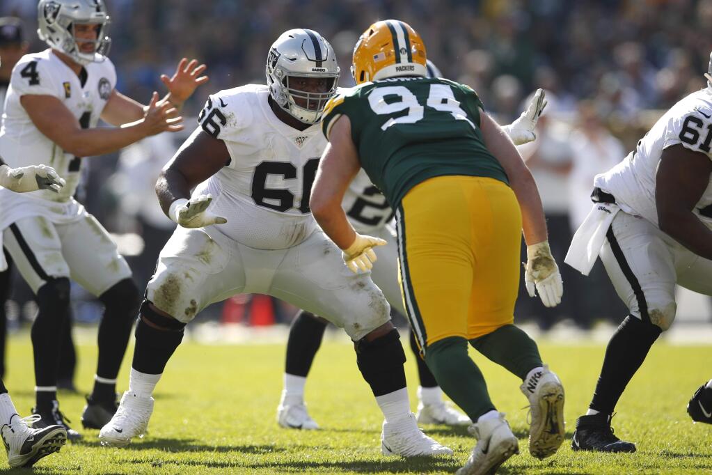 Oakland Raiders center Rodney Hudson (61) sets to block Green Bay Packers defensive end Dean Lowry (94) Sunday, Oct. 20, 2019, in Green Bay, Wis. The Packers won the game 42-24. (Jeff Haynes/AP Images for Panini)