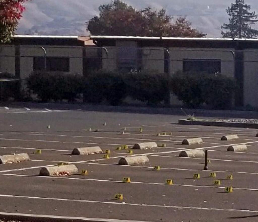 This Saturday, Nov. 23, 2019, photo released by the Union City Police Department shows crime scene evidence markers at the parking lot of the Searles Elementary School in Union City, Calif. Police say a deadly shootings of teenage boys took place early Saturday morning in the parking lot. Authorities say that when officers arrived, they found the boys. (Union City Police Department via AP)