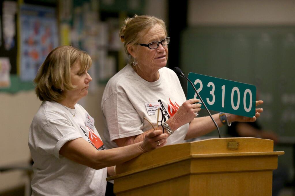 Jan Connors, left, and Teri Mendelson, co-community leaders for the northeastern Geyserville C.O.P.E. group (Citizens Organized to Prepare for Emergencies) speak about the importance of all rural residents getting a reflective address sign during a meeting at Geyserville New Tech Academy in Geyserville on Sunday, September 22, 2019. (BETH SCHLANKER/ The Press Democrat)