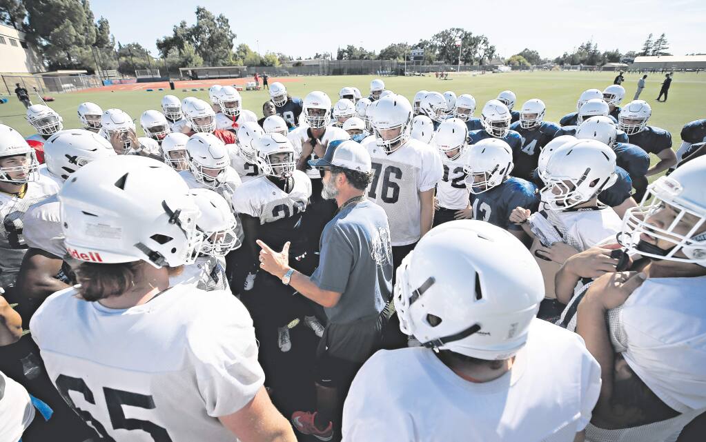 Santa Rosa Junior College head football coach Lenny Wagner gathers his team for practice, Wednesday, August 21, 2019. (Kent Porter / The Press Democrat)
