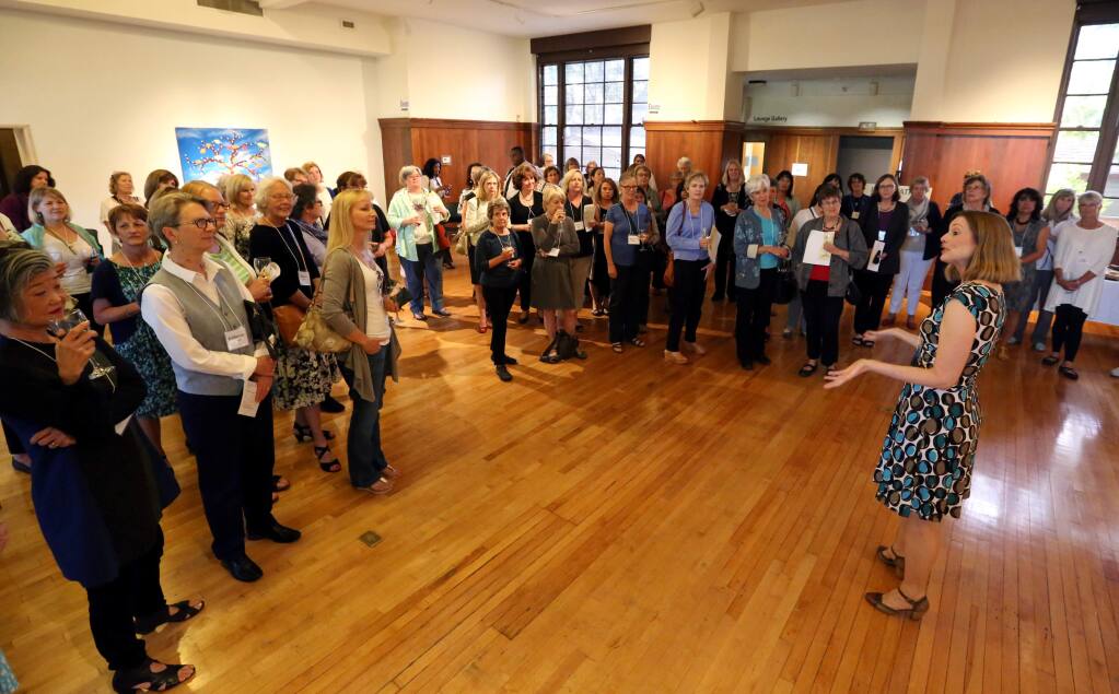 Melissa Kelley, founding member, right, speaks to the attendees of the Impact 100 Redwood Circle Kickoff Event hosted by the Community Foundation Sonoma County and held at the Museums of Sonoma County in Santa Rosa, Wednesday, June 10, 2015. (CRISTA JEREMIASON / The Press Democrat)
