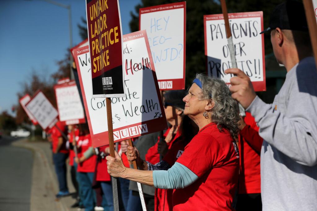 MRI tech Janice Cuneo takes part in a 24-hour long strike of union medical technicians and other support staff at Petaluma Valley Hospital in Petaluma on Wednesday, November 20, 2019. (BETH SCHLANKER/ The Press Democrat)