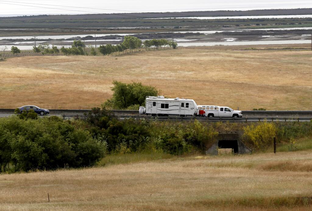Cars travel on Highway 37 over a tunnel being used as a wildlife corridor, connecting land owned by the Sonoma Land Trust to land owned by the San Pablo Bay National Wildlife Refuge near Petaluma, on Thursday, May 21, 2015. (BETH SCHLANKER/THE PRESS DEMOCRAT)