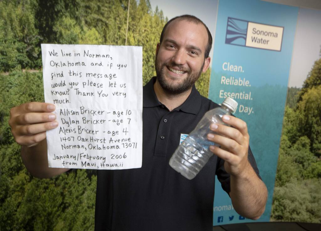 Eric McDermott, a biologist for the water agency, found a message in a bottle during an Earth Day clean-up in Jenner. The bottle had been floating since 2006 and the authors have since moved to Santa Rosa. (photo by John Burgess/The Press Democrat)