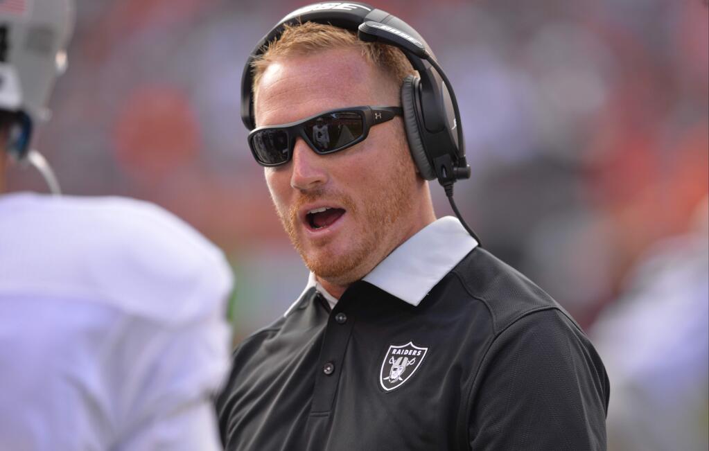 Oakland Raiders quarterbacks coach Todd Downing stands on the sideline Sunday, Sept. 27, 2015, in Cleveland. (AP Photo/David Richard)