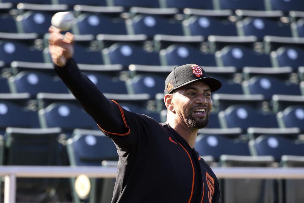 San Francisco Giants pitcher Tyson Ross warms up during spring training baseball workouts for pitchers and catchers Wednesday, Feb. 12, 2020, in Scottsdale, Ariz. (AP Photo/Ross D. Franklin)