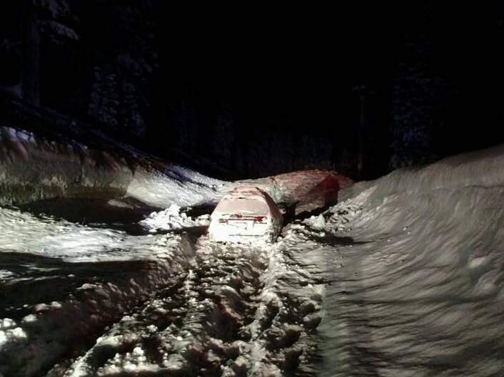 An avalanche on Highway 89 engulfed the vehicle of two men early Monday morning, Jan. 23, 2017. The men were later rescued. (WWW.FACEBOOK.COM/CHPTRUCKEE)