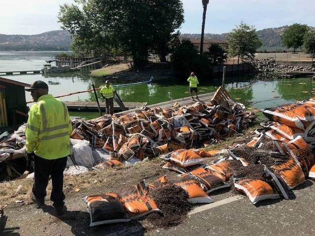 A flatbed semi-trailer hauling bags of soil crashed into Clear Lake early Friday morning. Eastbound Highway 20 near Hillside Lane in Clearlake Oaks was closed for about eight hours as authorities worked to remove the flatbed trailer, bags of soil and other debris from the crash. (Clear Lake Area CHP)