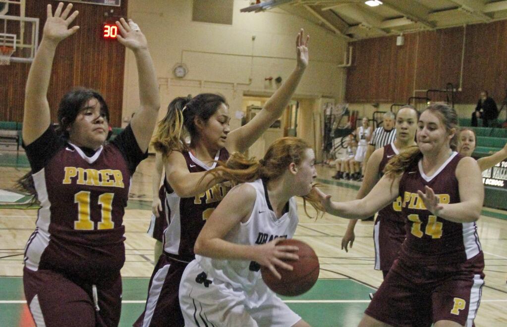 Bill Hoban/Index-TribuneSonoma's Kayla Field finds herself surrounded after pulling down a rebound in Friday's game against Piner. The Lady Dragons used their full-court press to tie the Prospectors up. Sonoma won 41-12 to keep their SCL record perfect at 6-0.