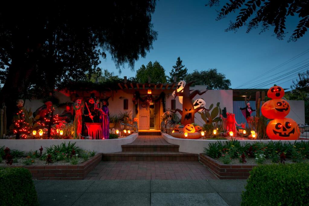 There's a lot going on in front of this East Napa Street house -- witches, skeletons, angry trees, light-up skulls and 'Monster Mash' playing on a loop. (Photo by Julie Vader/special to the Index-Tribune)