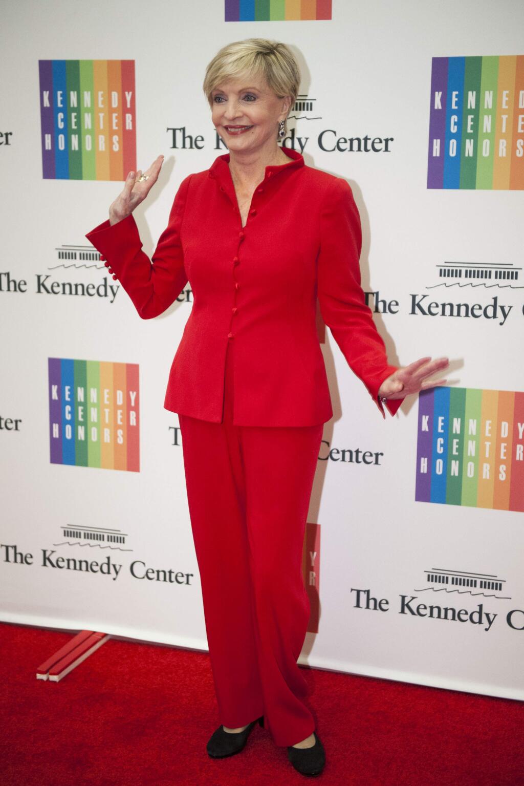 Florence Henderson poses for photos on the red carpet at the State Department Dinner for the Kennedy Center Honors on Saturday, Dec. 6, 2014 at the State Department in Washington. (AP Photo/Kevin Wolf)