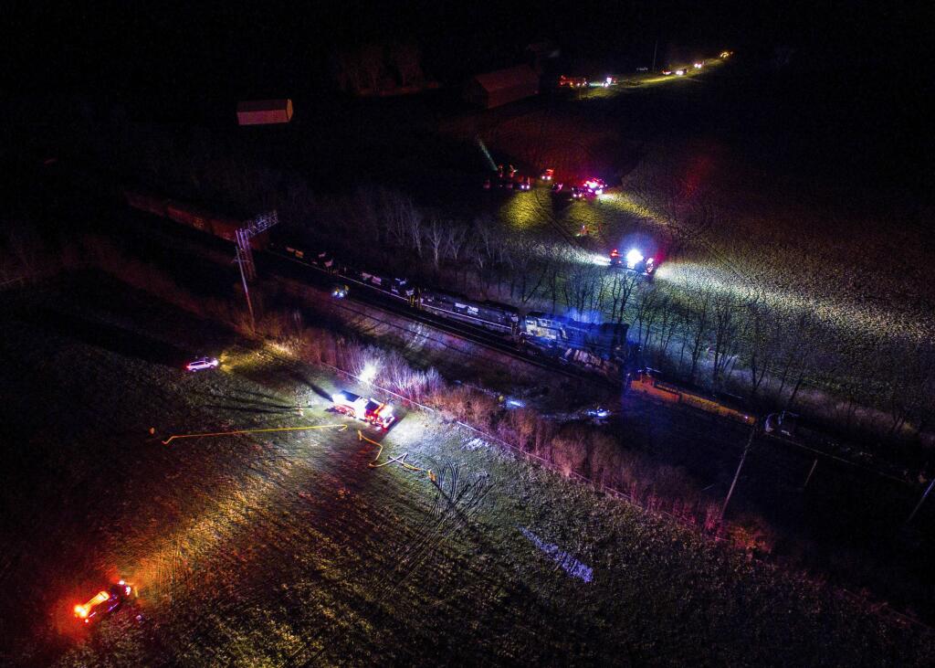 This photo provided by Nicholas Waun shows the scene where two trains collided and derailed in Georgetown, Ky., early Monday, March 19, 2018. Four people were injured after the accident late Sunday night. (Nicholas Waun via AP)