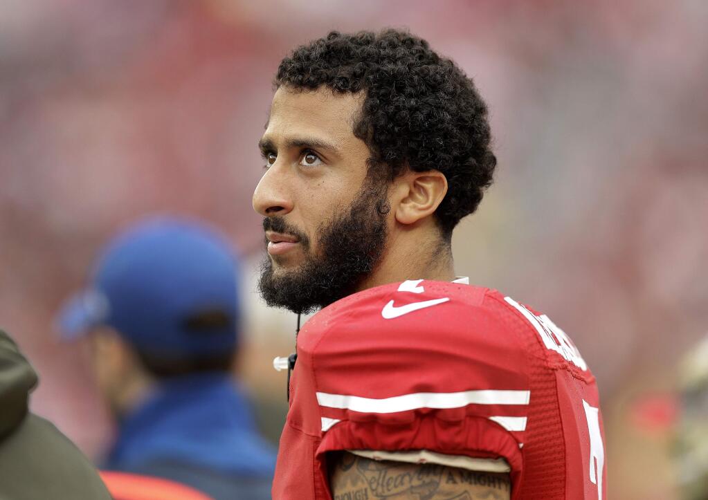 In this Nov. 8, 2015, file photo, San Francisco 49ers quarterback Colin Kaepernick stands on the field during a game against the Atlanta Falcons in Santa Clara. (AP Photo/Ben Margot, File)