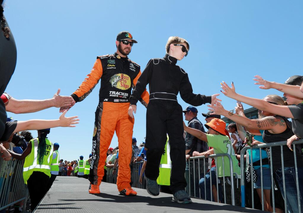 Driver Martin Truex Jr. of Bass Pro Shops Toyota, interacts with fans along with local youth racers at pre-race ceremonies for the Toyota/Save Mart 350 Monster Energy NASCAR Cup Series Race, at Sonoma Raceway, on Sunday, June 23, 2019. (Photo by Darryl Bush / For The Press Democrat)