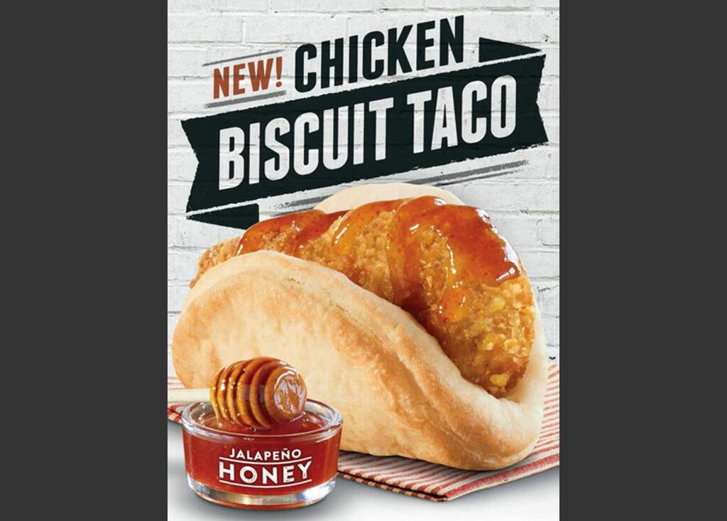 This image provided by Taco Bell shows an ad shows the restaurant chain's new chicken 'biscuit taco'. Taco Bell's new ad campaign promoting its the new offering aims to paint McDonald's Egg McMuffins as boring, routine food for the brainwashed. (AP Photo/Taco Bell)
