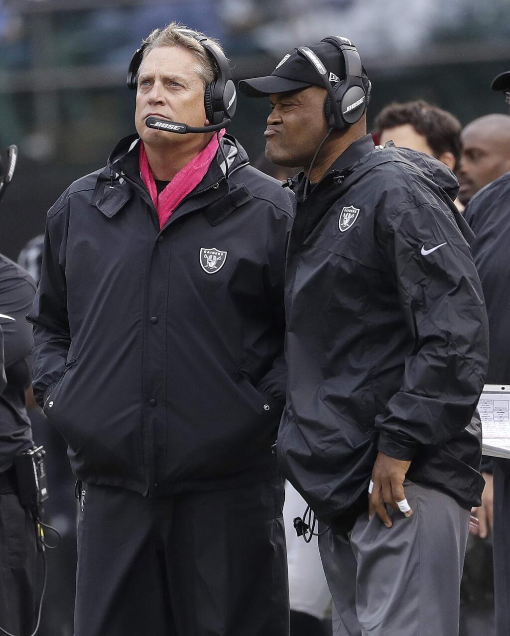Oakland Raiders head coach Jack Del Rio, left, and defensive coordinator Ken Norton Jr. watch from the sideline during the second half against the Kansas City Chiefs in Oakland, Sunday, Oct. 16, 2016. (AP Photo/Marcio Jose Sanchez)