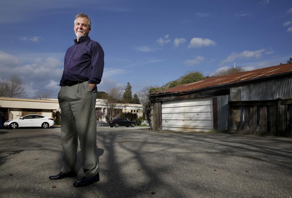 Architect and developer Ross Jones stands in the lot of a proposed parking shed for The Petaluman, a boutique hotel under development. The lot is located at 6 5th St in a historic neighborhood in Petaluma, California on Tuesday, March 3, 2015. (BETH SCHLANKER/ The Press Democrat)