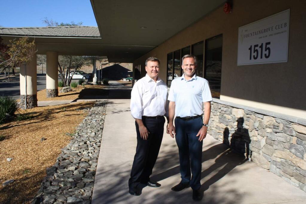 Mark Leavitt (left), past president of the Fountaingrove Golf and Country Club, past president and board liaison to the steering committee and architect on the building design, and Chief Operating Officer Ron Banaszak in front of the Athletic Center that survived the fire to also become a Comfort Center for fire victims. (Gary Quackenbush / for North Bay Business Journal) October 2018