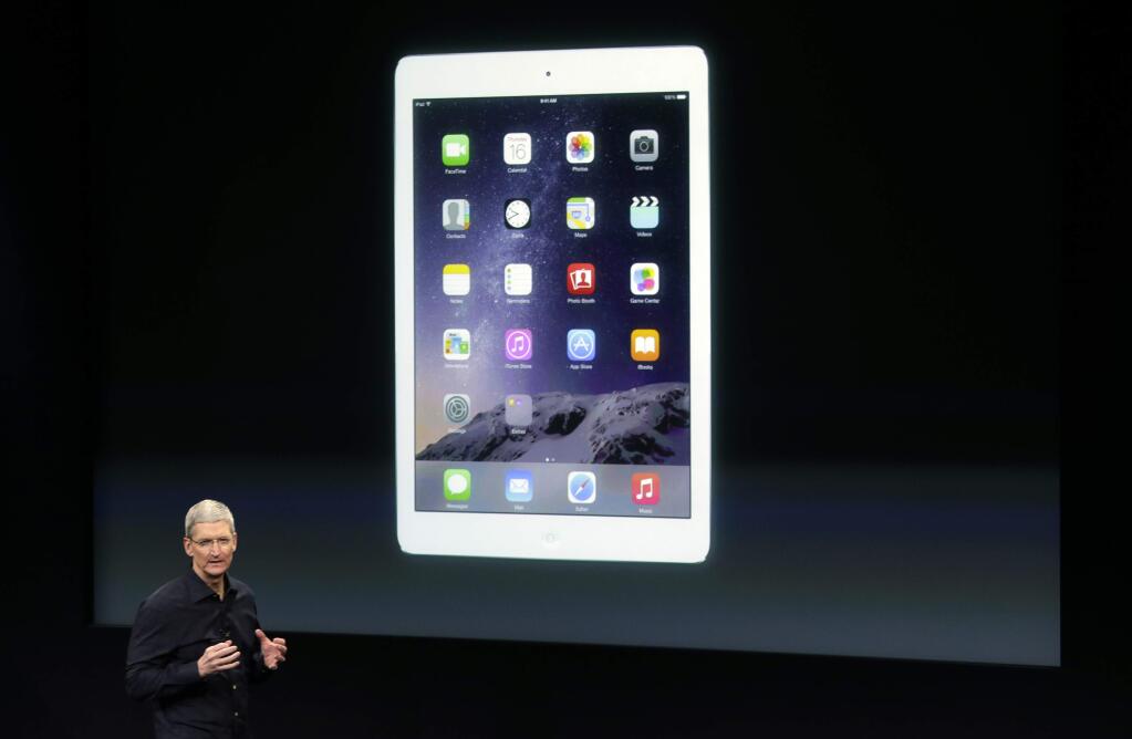 Apple CEO Tim Cook introduces the new Apple iPad Air 2 during an event at Apple headquarters on Thursday, Oct. 16, 2014 in Cupertino, Calif. (AP Photo/Marcio Jose Sanchez)