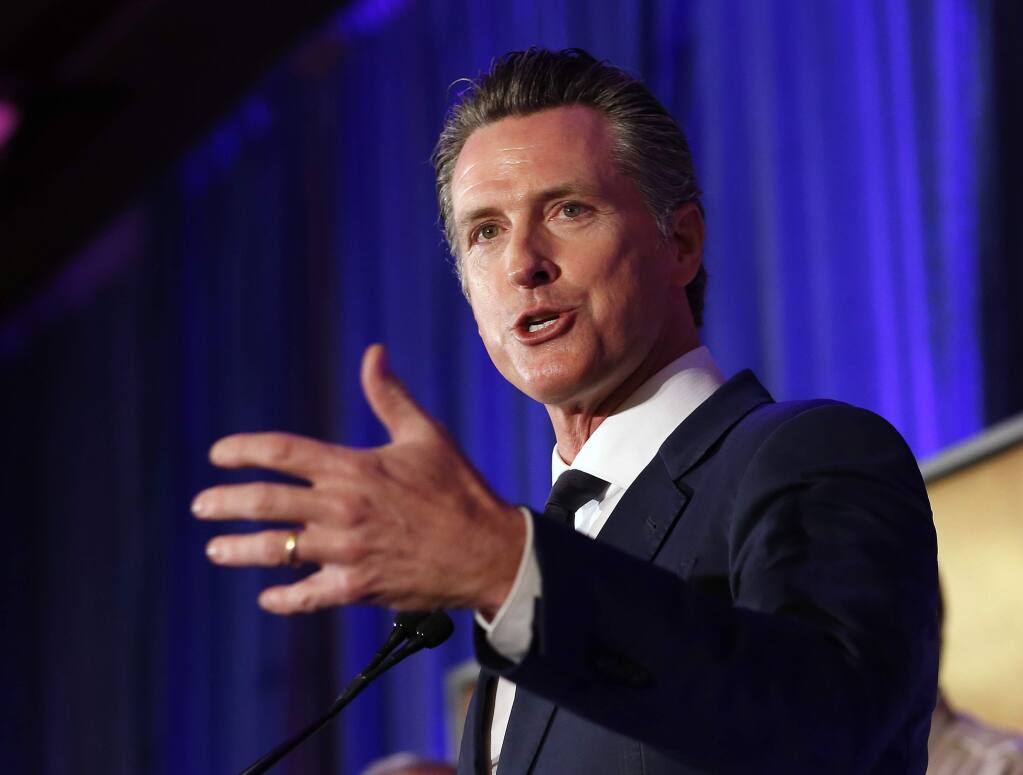California Gov. Gavin Newsom speaks at the California for All Emergency Management Preparedness Summit, Monday, June 3, 2019, in Sacramento, Calif. Newsom said Monday that the Defense Department as agreed to provide information from a Cold War-era military satellite to help spot wildfires, while the defense secretary also gave the California National Guard blanket approval through the year's end to use unmanned drones to map fires, count destroyed houses and spot survivors. (AP Photo/Rich Pedroncelli)