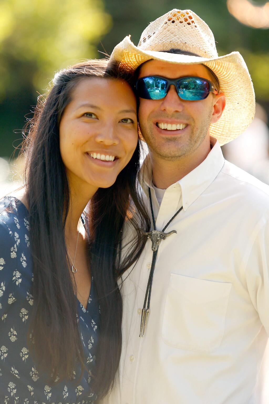 Allison Wong and Mark Flowers attend Love of the Land hosted by the Sonoma County Farm Bureau, at Richard's Grove and Saralee's Vineyard, in Windsor, California, on Thursday, July 12, 2018. (Alvin Jornada / The Press Democrat)