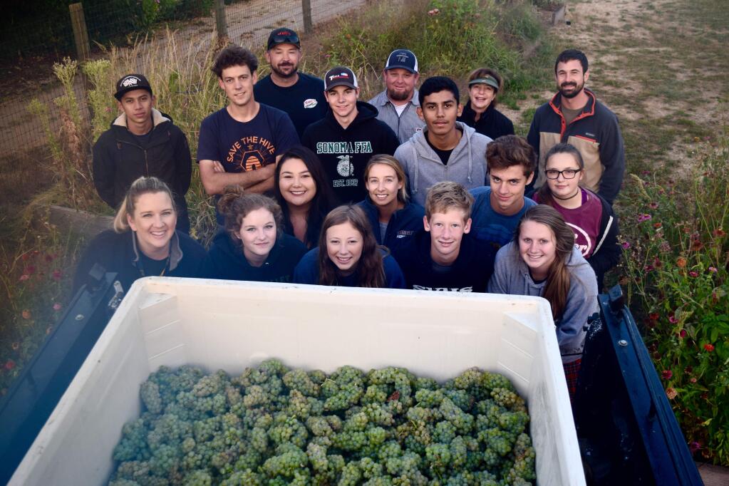SVHS agriculture teacher Dan Aschwanden, back row fourth from right in baseball cap, pictured with students and SVHS staff.  File photo,