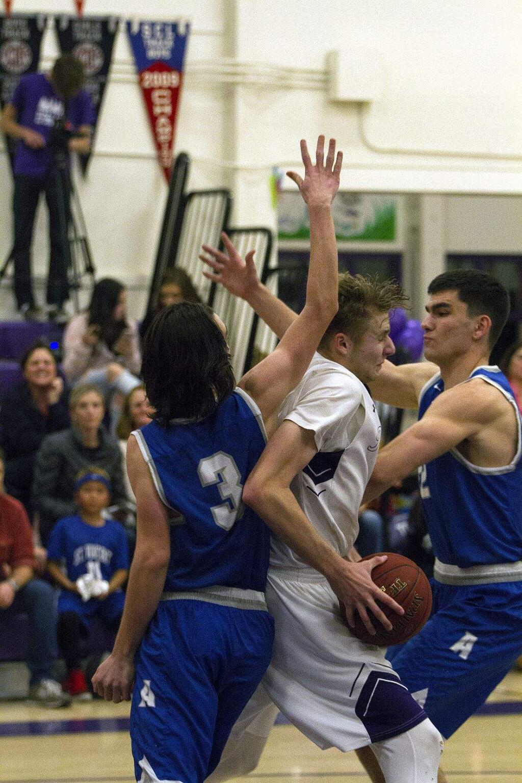 DWIGHT SUGIOKA/FOR THE ARGUS-COURIERPetaluma was squeezed by an agressive Analy defense and lost on Senior Night, 62-46.