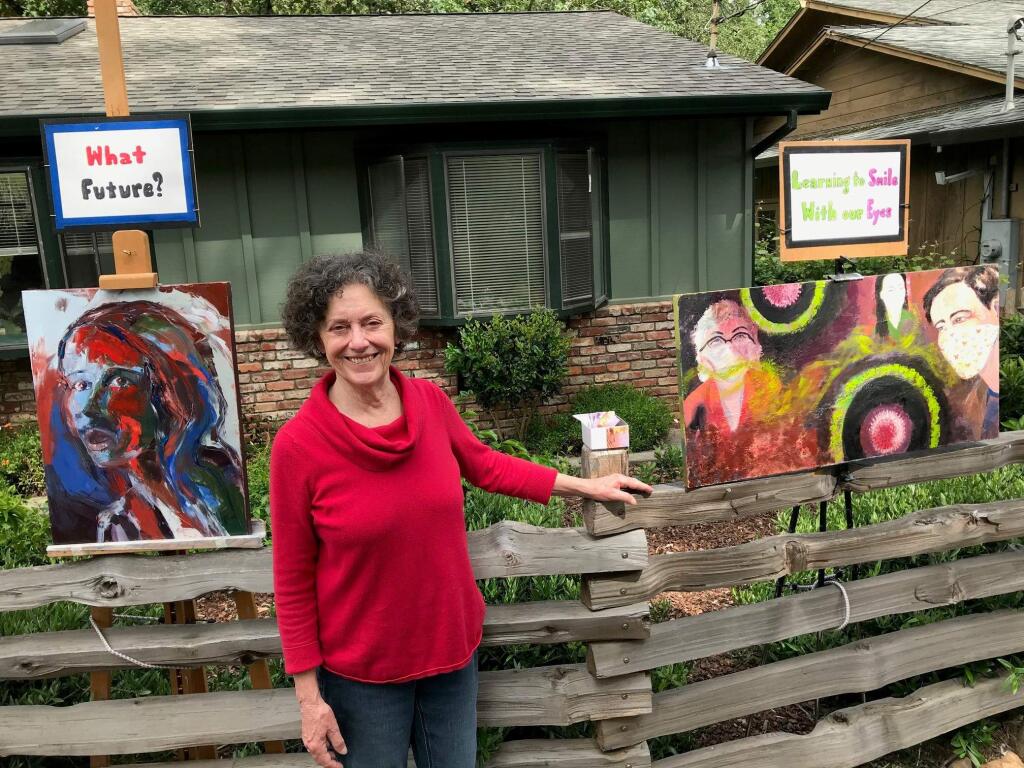 After noticing more people out walking in her neighborhood during the pandemic, artist Kathleen Truax started displaying her work in front of her home, to give passers-by something to look at on their walks. Photo by David Quaife