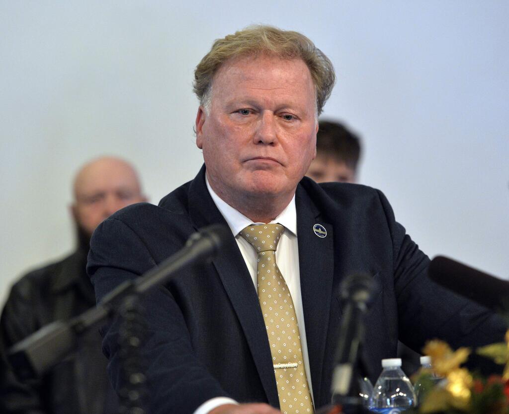 FILE - In this Tuesday, Dec. 12, 2017, file photo, Kentucky State Rep. Republican Dan Johnson addresses the public from his church regarding sexual assault allegations in Louisville, Ky. Johnson died Wednesday night, Dec. 13, 2017. Bullitt County Coroner Dave Billings says it was 'probably suicide,' and an autopsy is scheduled for Thursday morning. (AP Photo/Timothy D. Easley, File)
