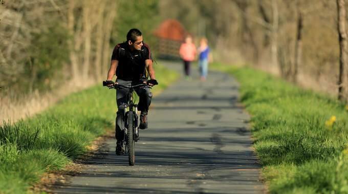A leisurely ride on your favorite road or trail (Santa Rosa Creek Trail, here) without a helmet could cost you money; proposed legislation would require that anyone riding a bike without sans head gear would face a fine, Friday Feb. 13, 2014. (Kent Porter / Press Democrat) 2015
