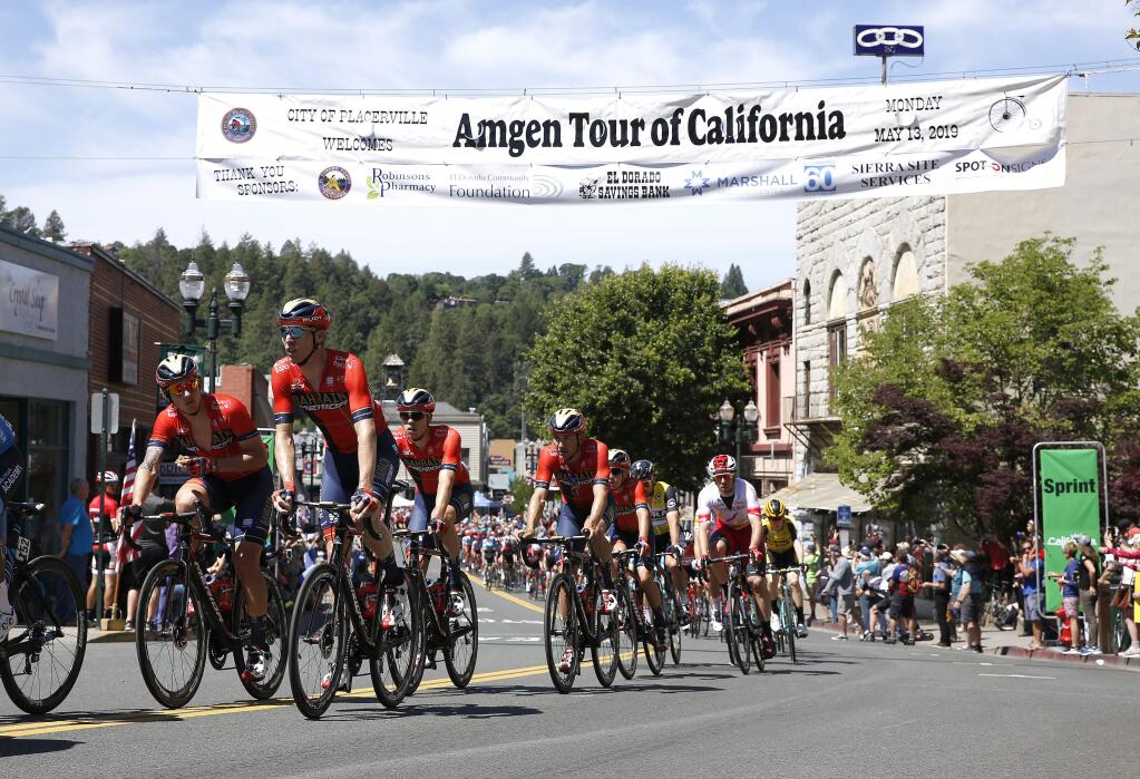 The peloton sprints down Main Street during the second stage of the Amgen Tour of California cycling race Monday, May 13, 2019, in Placerville, Calif. (AP Photo/Rich Pedroncelli)