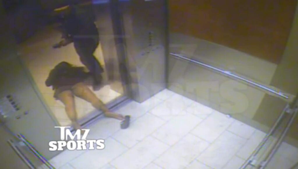 An image taken from a hotel security video released by TMZ Sports shows Baltimore Ravens running back Ray Rice dragging his fiancee, Janay Palmer, out of an elevator moments after knocking her off her feet into the elevator's railing at the Revel casino in Atlantic City, N.J.