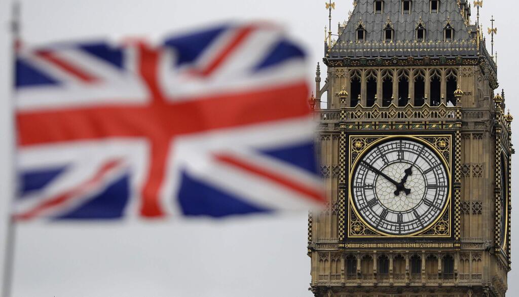 FILE - In this file photo dated Wednesday, March 29, 2017, a British flag blown by the wind near to Big Ben's clock tower in front of the Houses of Parliament in central London, Wednesday, March 29, 2017. According to a statement released from the House of Commons Saturday June 24, 2017, British officials are investigating an alleged cyberattack Saturday on the country's Parliament after discovering 'unauthorized attempts to access parliamentary user accounts.' (AP Photo/Matt Dunham, FILE)