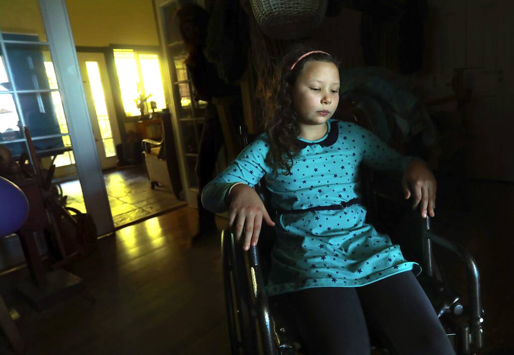 Luccia Montiel, 9, uses a wheelchair to move around her Sonoma coast home since being diagnosed with Lyme disease. (John Burgess/The Press Democrat)