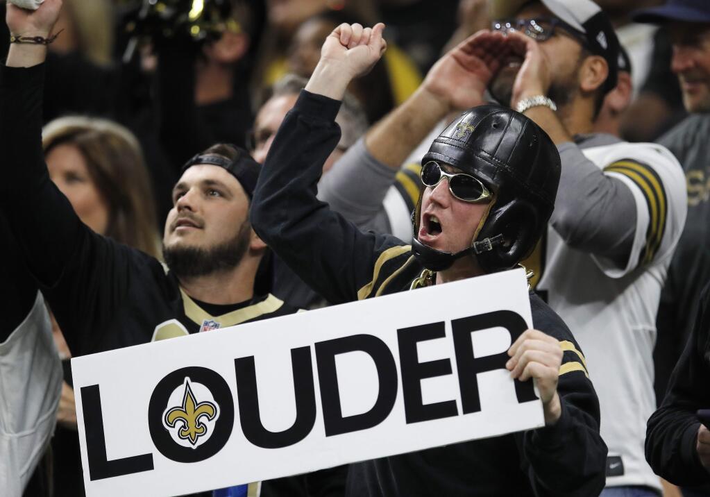 Fans cheer during the first half the NFL football NFC championship game between the New Orleans Saints and the Los Angeles Rams, Sunday, Jan. 20, 2019, in New Orleans. (AP Photo/Carolyn Kaster)
