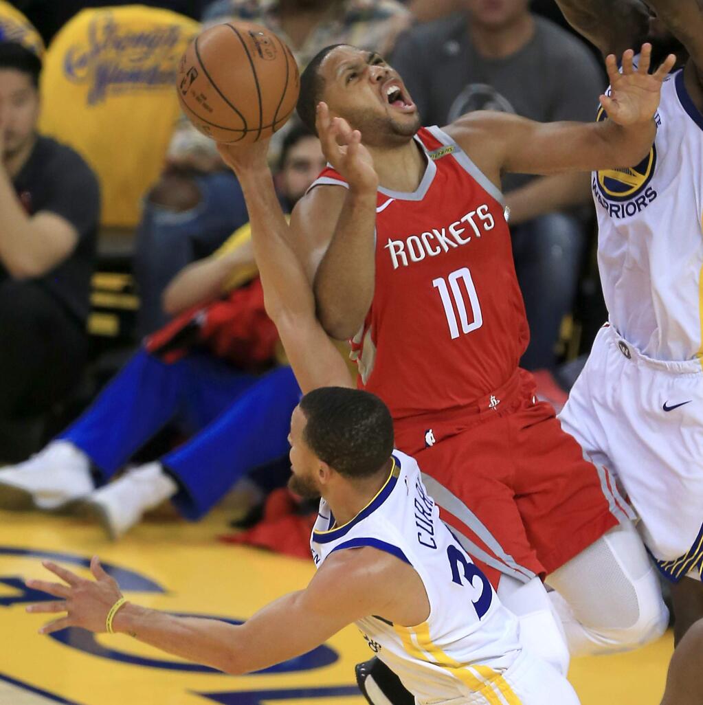 Stephen Curry blocks Eric Gordon's shot in the Warriors 115-86 win over Houston during game 6 of the NBA Western Conference finals In Oakland, Saturday May 26, 2018. (Kent Porter / The Press Democrat) 2018