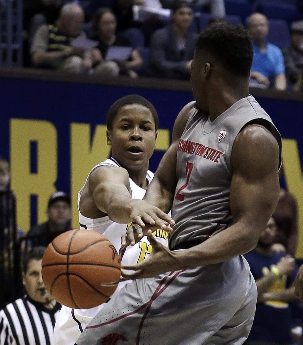 California's Charlie Moore, left, defends against Washington State's Ike Iroegbu (2) in the first half of an NCAA college basketball game Saturday, Jan. 14, 2017, in Berkeley, Calif. (AP Photo/Ben Margot)