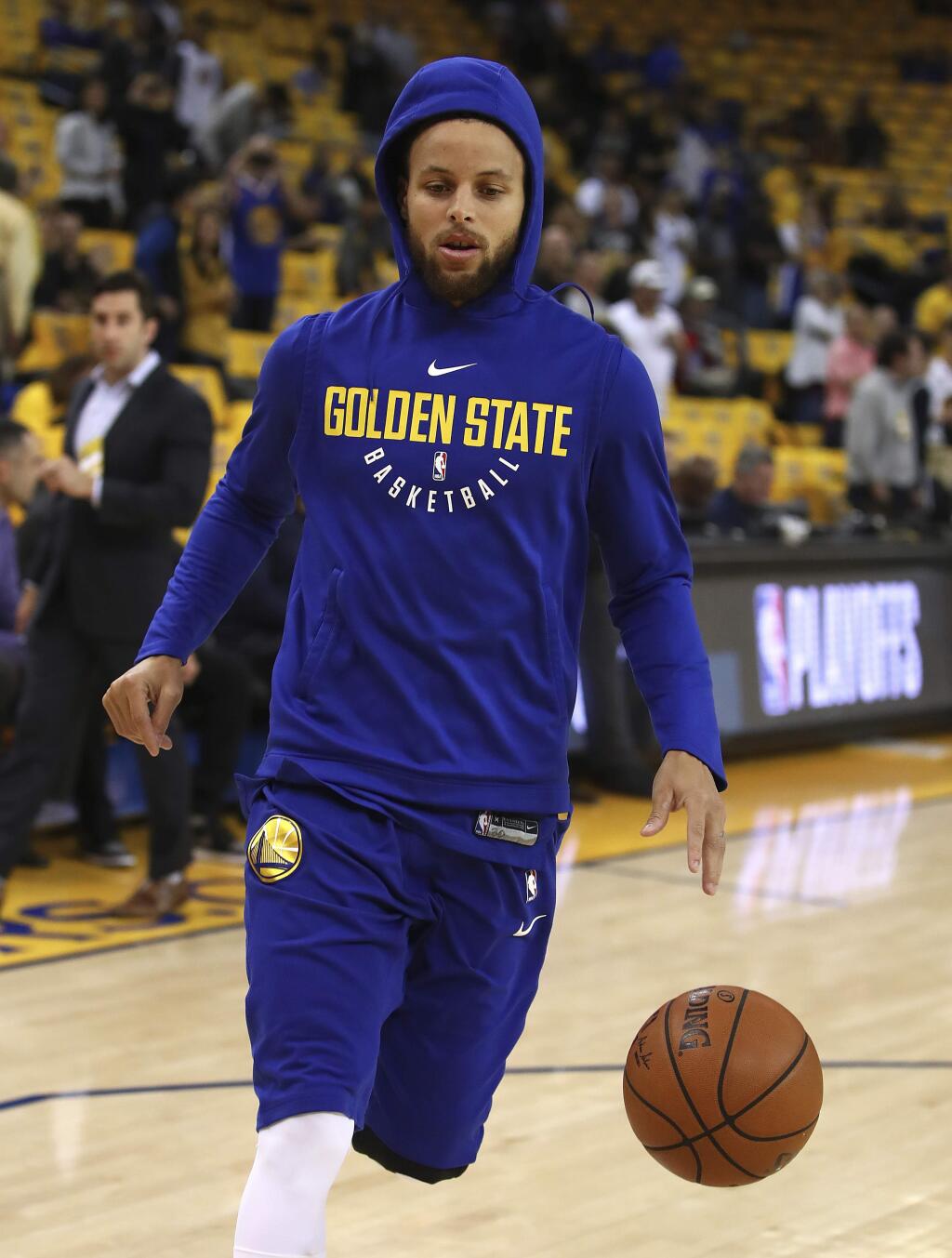 Golden State Warriors' Stephen Curry warms up prior to Game 1 of a first-round NBA basketball playoff series against the San Antonio Spurs Saturday, April 14, 2018, in Oakland, Calif. (AP Photo/Ben Margot)
