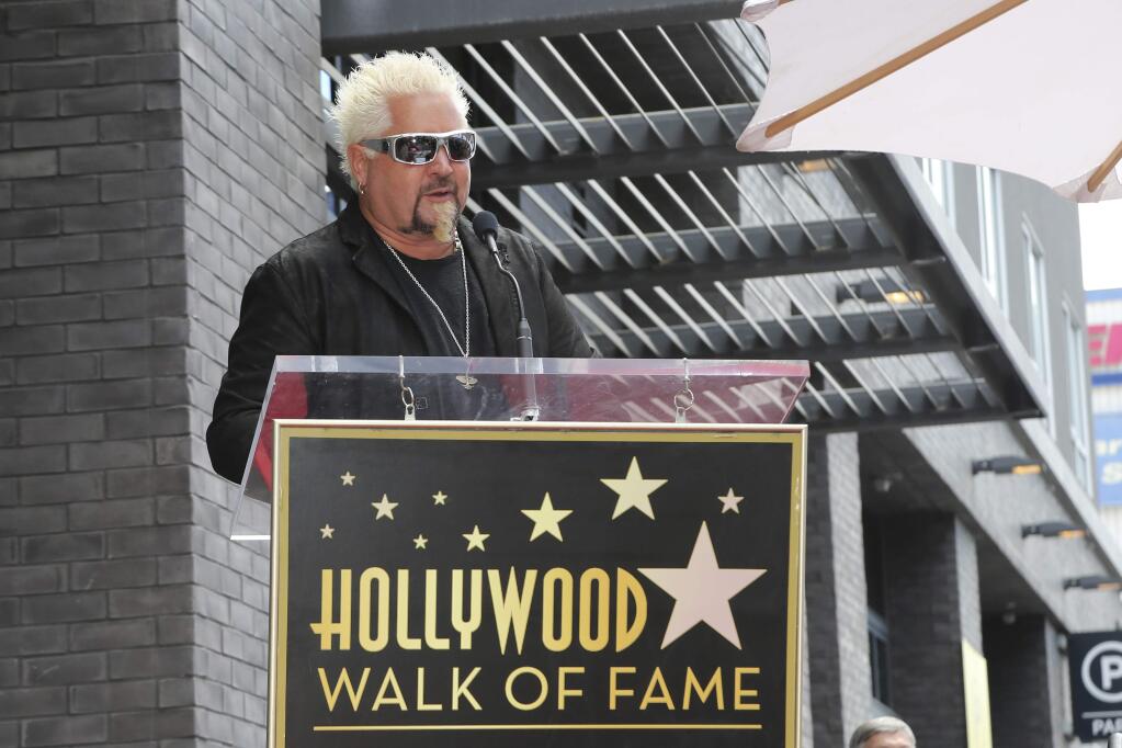 Guy Fieri speaks at a ceremony honoring him with a star at the Hollywood Walk of Fame on Wednesday, May 22, 2019, in Los Angeles. (AP/Willy Sanjuan)